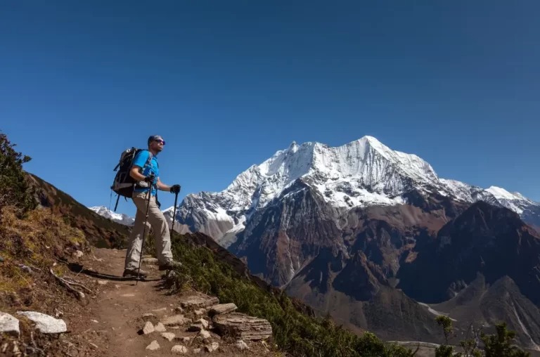 A Trekker Walking Towars Manaslu Base Camp From Samagaun 768x508